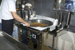 © WH_Pics - Churros preparation. Frying the wheel