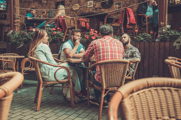 Wall Mural - Good old friends waiting for order in a pub