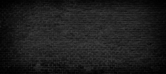 Old black brick wall background.