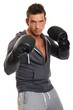 © petrdlouhy - Handsome boxer man with gloves on white background