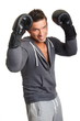 © petrdlouhy - Handsome smiling boxer man with gloves on white background