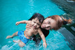 © taoty - The kid and mom play together in the pool