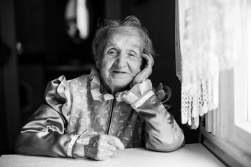 Wall Mural - Slavic ethnic portrait of an elderly woman. Black and white photo.