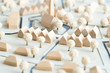 canvas print picture - Städtebauliches Modell aus Holz und Karton mit Weißen Bäumen