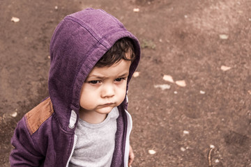 toddler with an adult serious look