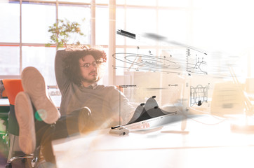 businessman sitting with legs on desk