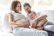 © Louis-Paul Photo - father, son and pregnant mother at home. Beautiful loving family portrait