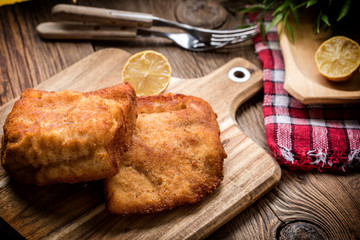 Two fried cod fillet pieces.