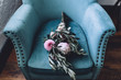 © Thais Ramos Varela/Stocksy - wedding bouquet on a couch