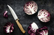 © Pixel Stories/Stocksy - Halved radicchio on dark metal background
