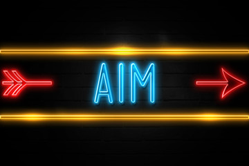 Aim  - fluorescent Neon Sign on brickwall Front view