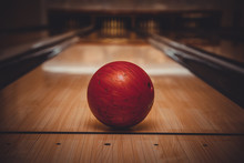 Red Bowling Ball On The Track In The Bowling Center