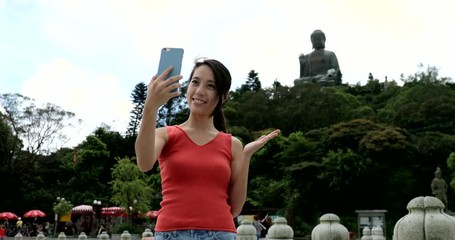 Sticker - Hong Kong, 08 August 2017 -:Woman taking selfie with Tian Tan Buddha statue