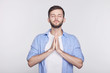 © Yulia - Yoga and meditation concept. Concentrated relaxed Caucasian man closing eyes having relaxation, meditating trying to find balance and harmony practicing yoga resting during coffee break at the office.