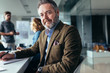 © Jacob Lund - Mature businessman sitting in meeting room
