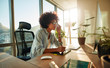 © Jacob Lund - African female designer busy working at her desk