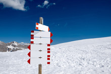 Blank Signpost In The Snowy Mountains With Many Directions