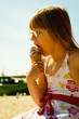 © Voyagerix - Toddler girl eating ice cream on beach