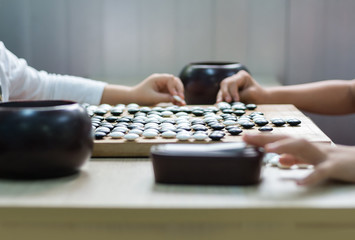 Chinese Go or Weiqi board game - black and stone