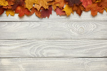 Wooden Background With Autumn Leaves
