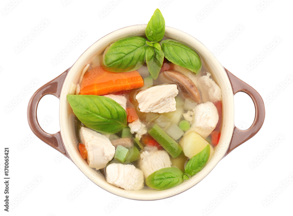 Casserole with delicious turkey soup on white background