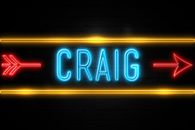 Craig  - Fluorescent Neon Sign On Brickwall Front View
