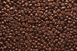 © ktsdesign - Roasted coffee beans on a flat background.