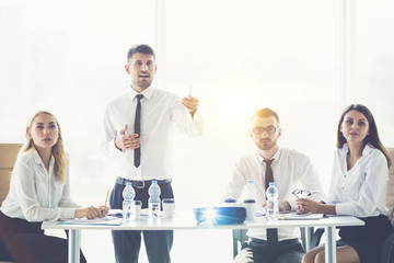 Wall Mural - The business people discuss a presentation on the sunny background