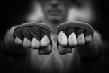 Beautiful black and white image of male fists in boxing taping