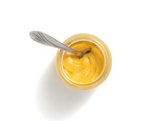 Mustard Sauce In Plate On White Background
