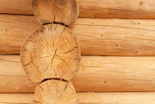 Modern Hand Hewn Natural Log Cabin Wall Facade Frame Texture. Rustic Log Wall Square Timber Background.