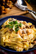© Arkadiusz Fajer - Tagliatelle pasta with forest mushrooms and chicken.