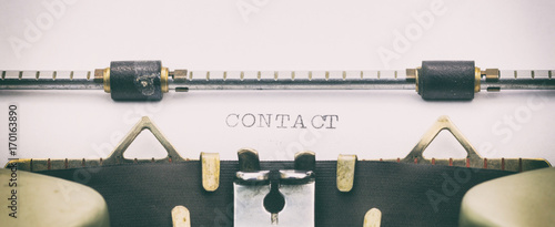Fotomural Contact word in capital letters on white sheet