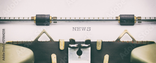 Fotomural News word in capital letters on white sheet