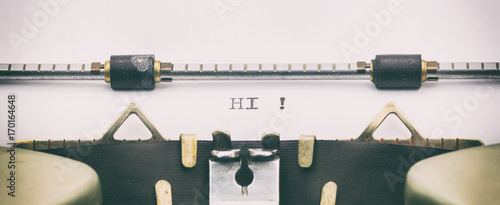 Fotomural Hi word in capital letters on white sheet