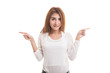 © halfbottle - Young Asian woman point to left and right.