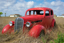 Old Red Car In The Field