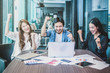 © THANANIT - Group Of AsianBusiness people with casual suit working with happy action and celebrate in the modern Office, people business group concept