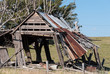 Old timber barn falling apart and leaning over