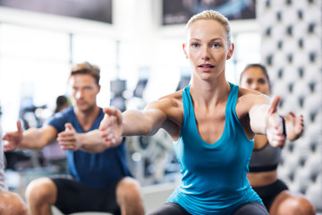 Wall Mural - Woman exercising in gym