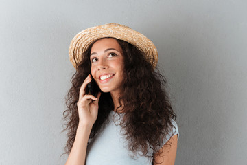 Wall Mural - Beautiful woman talking on phone isolated