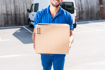 delivery man with cardboard box