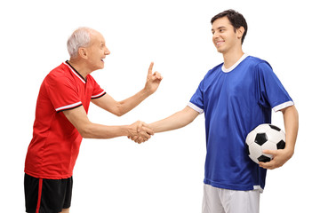 Poster - Old soccer player shaking hands with young player