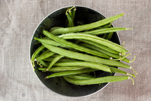 Green Beans In A Metal Bowl On Sackcloth
