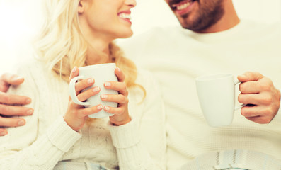 Sticker - close up of happy couple with tea cups at home