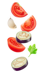 Poster - Isolated cut vegetables. Raw slices of eggplant, tomato and garlic flying in the air isolated on white background with clipping path