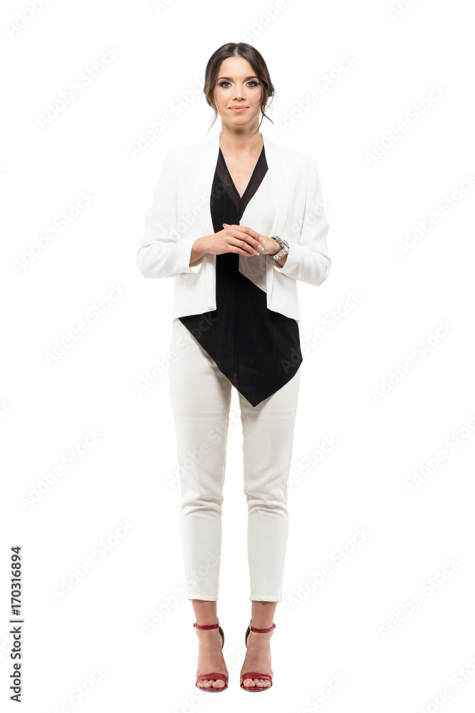 Friendly smiling business female presenter in formal suit with hands clasped looking at camera. Full body length portrait isolated on white background - obrazy, fototapety, plakaty 