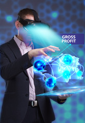 Business, Technology, Internet and network concept. Young businessman working in virtual reality glasses sees the inscription: Gross profit