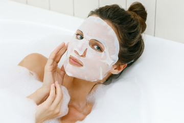 Wall Mural - woman with sheet mask on her face