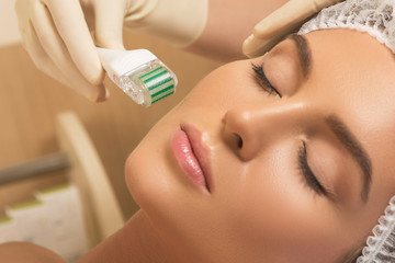 Wall Mural - Beautiful woman in beauty salon during mesotherapy procedure.